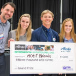 Student team behind MOtif Materials with giant check