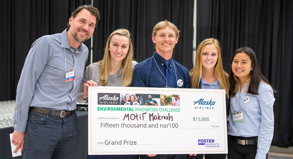 Student team behind MOtif Materials with giant check