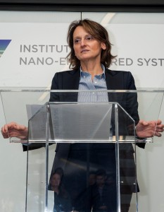 A woman speaking at a podium